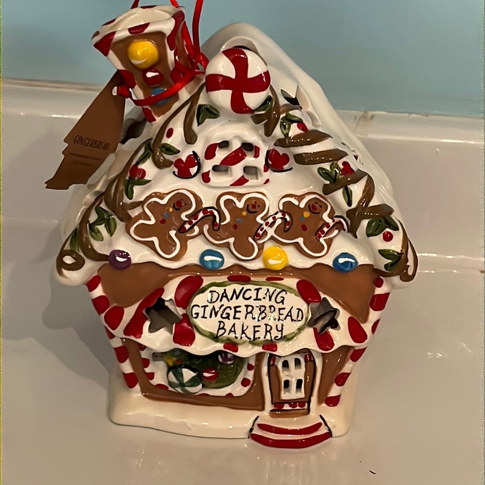 Blue sky dancing gingerbread candle house